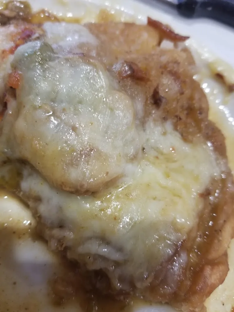 Chili Verde Quesadilla with Sauce and Cheese on Top